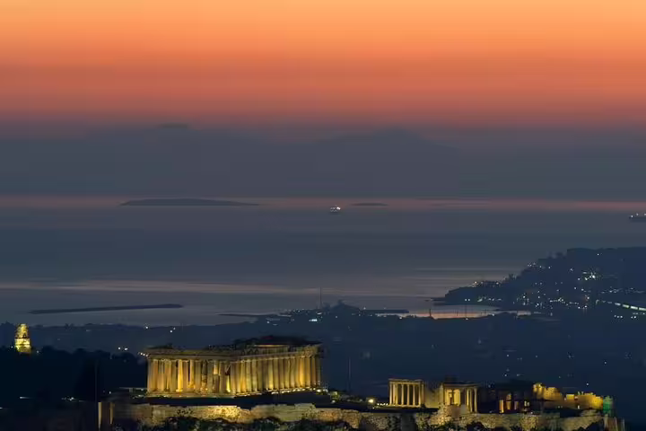 Parthenon glowing at sunset over Athens coast, scenic stop on a private tailor-made half-day city tour with Acropolis skip-the-line