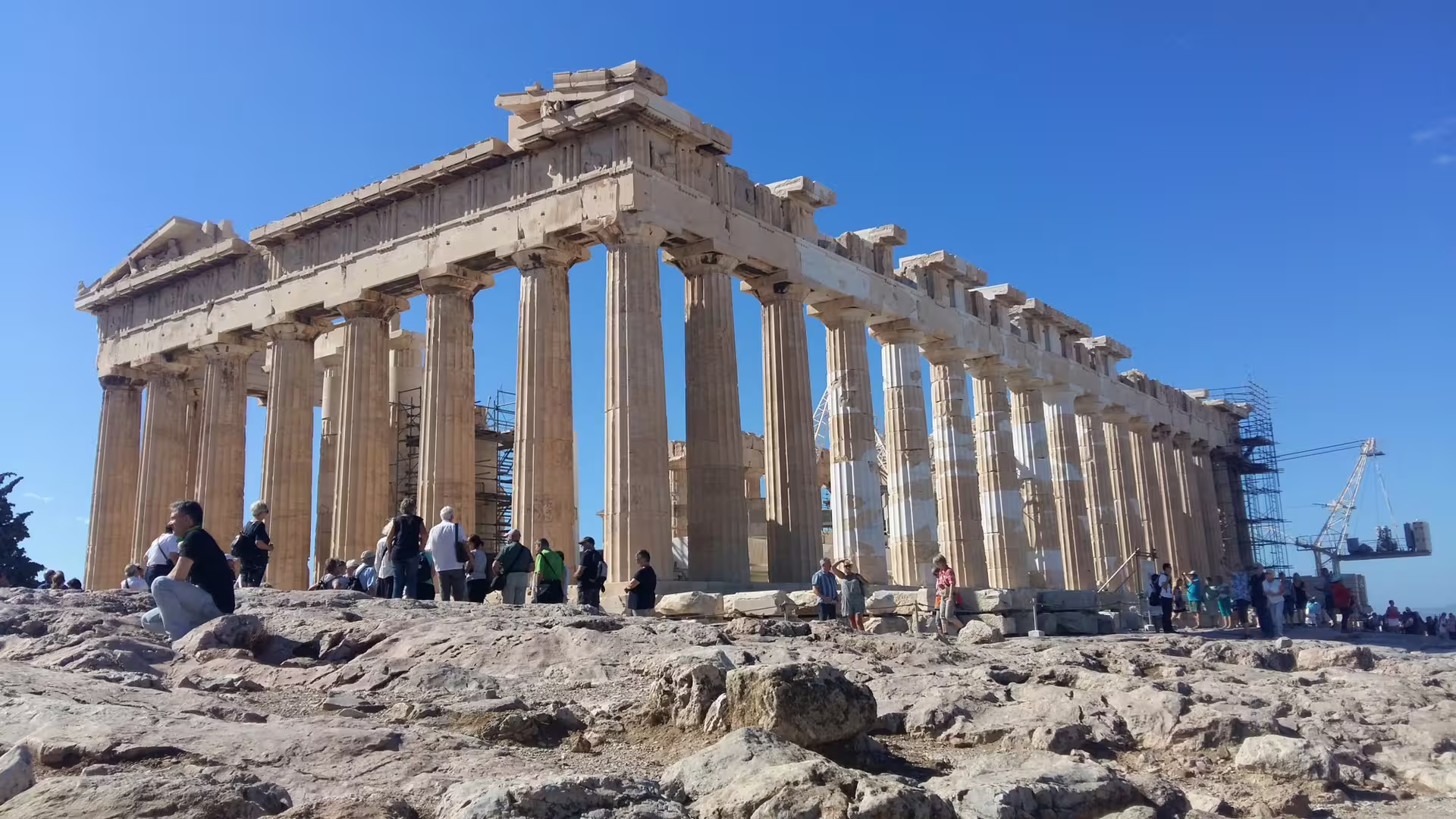 Parthenon temple on the Acropolis in Athens with tourists, highlight of Acropolis and Acropolis Museum guided tour