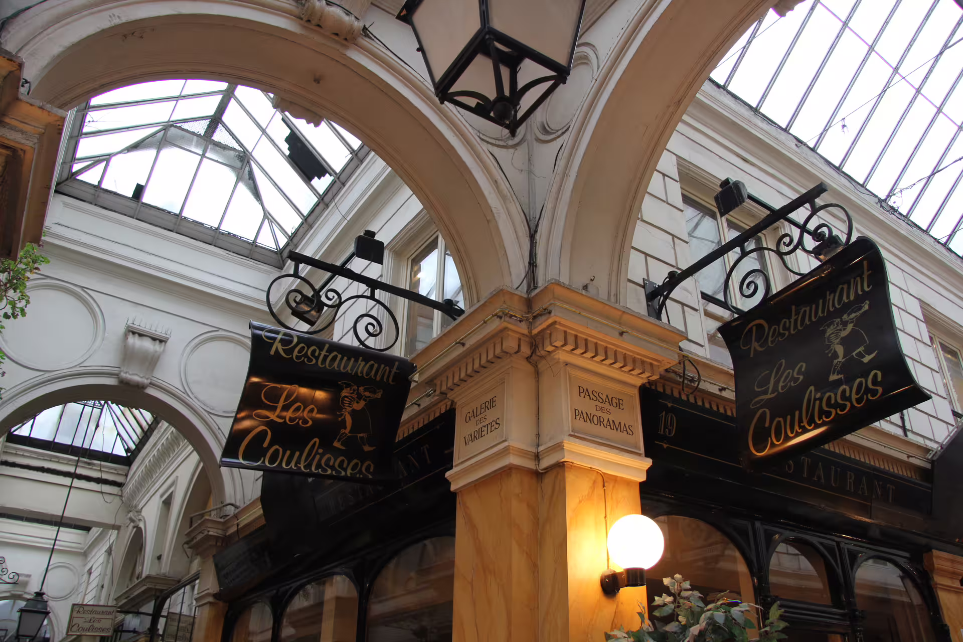 Restaurant Les Coulisses signs at Passage des Panoramas and Galerie des Variétés, Paris covered arcade