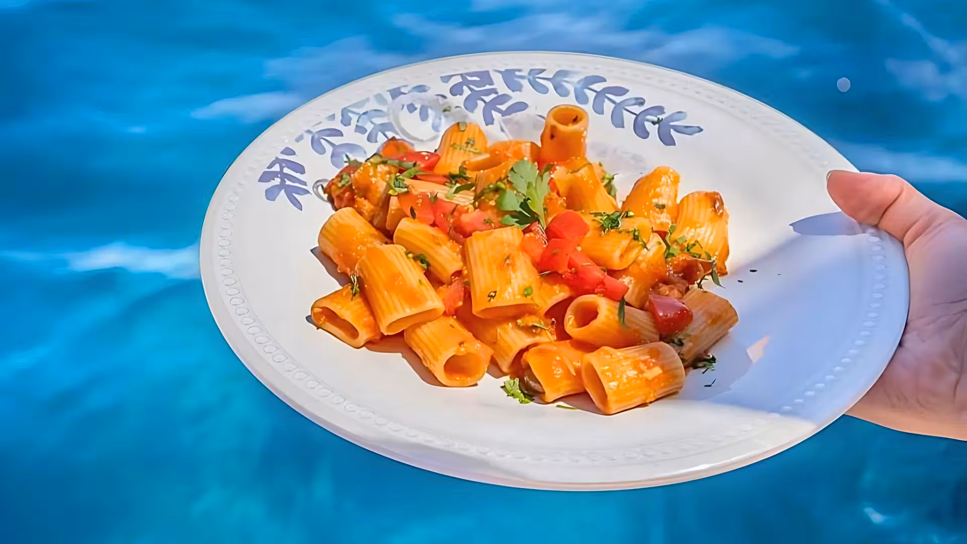 Delicious pasta dish served on a sailing tour in La Maddalena Archipelago, enhancing the Italian culinary experience.