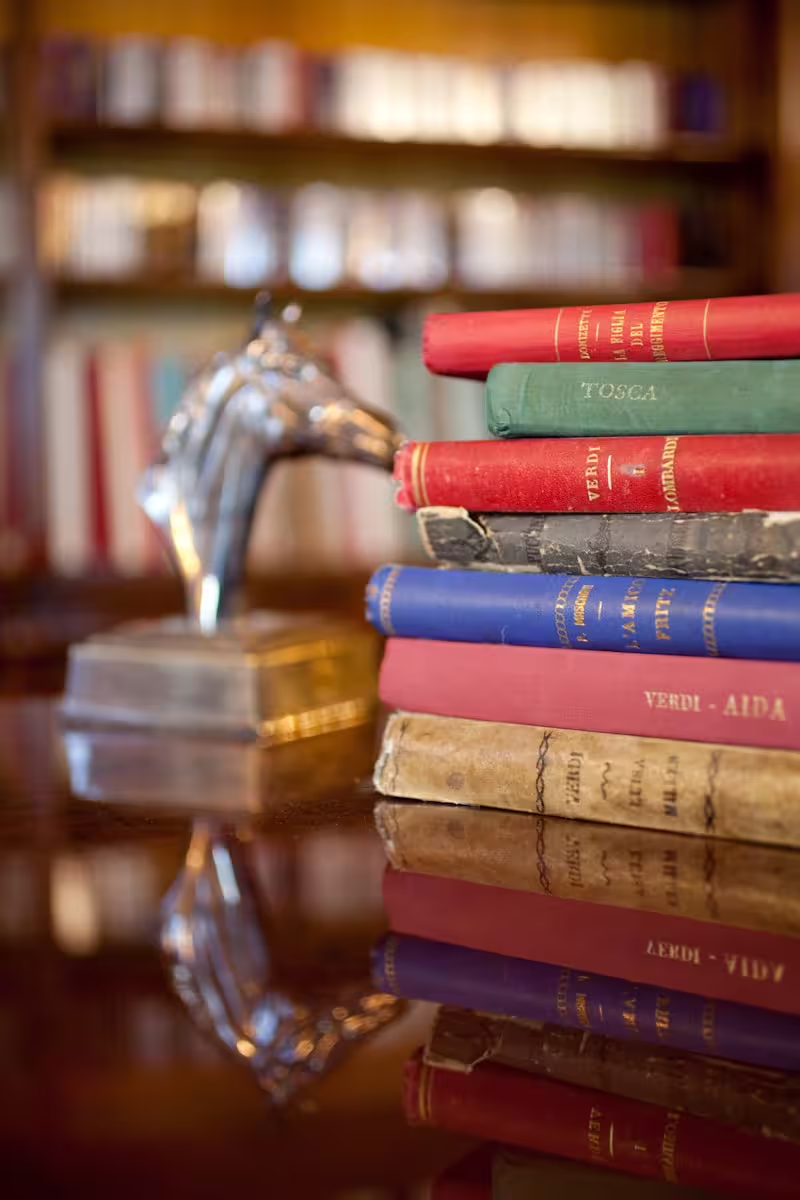 Vintage opera books in Luciano Pavarotti House Museum Modena, a highlight of the entrance ticket visit
