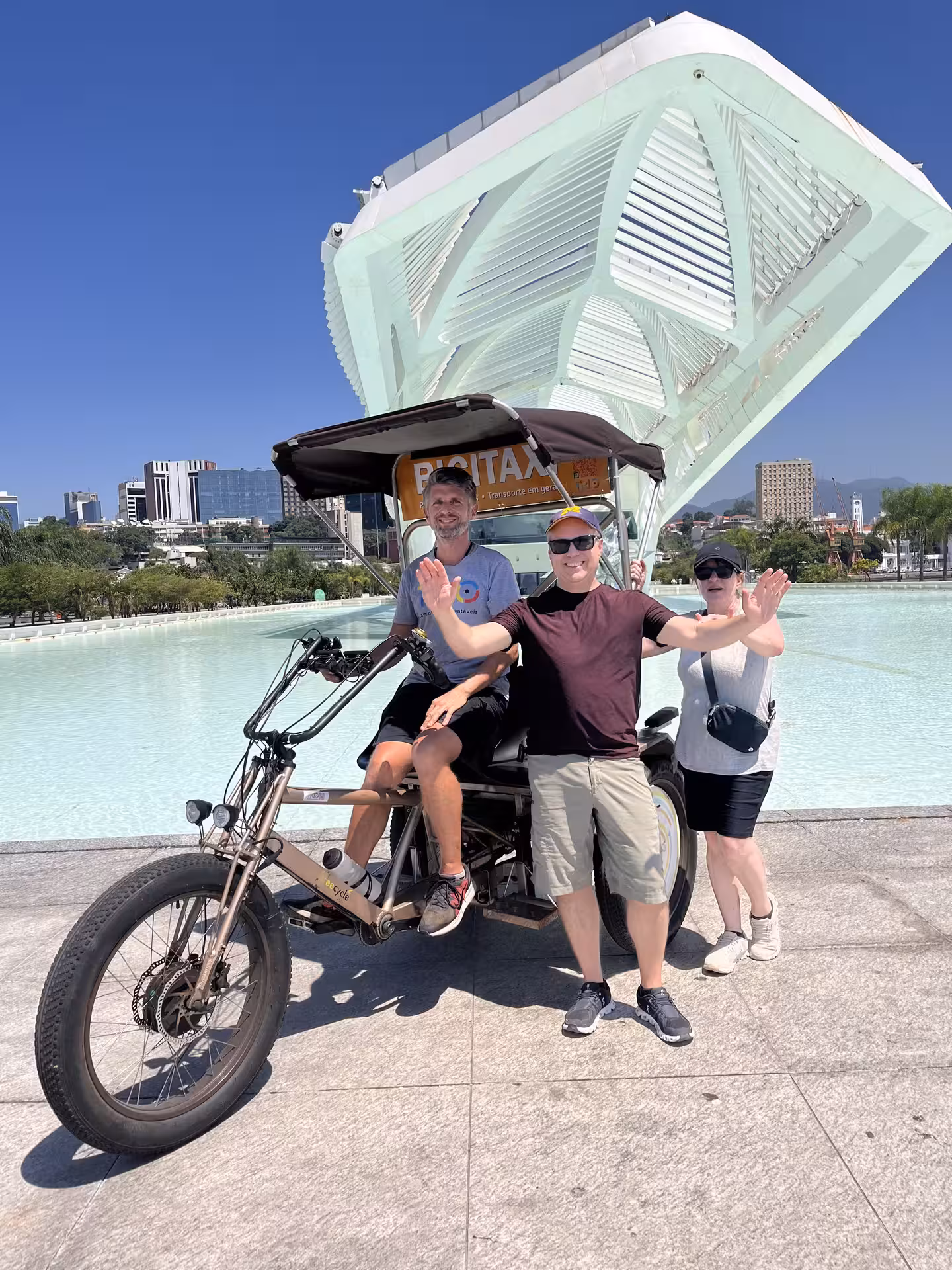 Guests pose with pedicab at Museu do Amanhã on Rio historical city centre tour in Praça Mauá