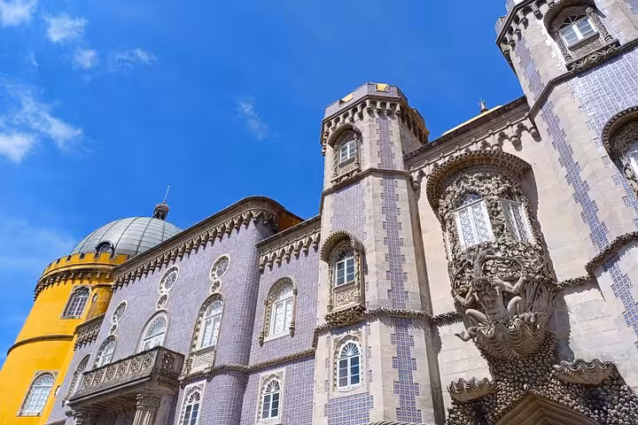 Close-up of Pena Palace facade in Sintra, a highlight stop on the Sintra Cascais tuk tuk palaces tour