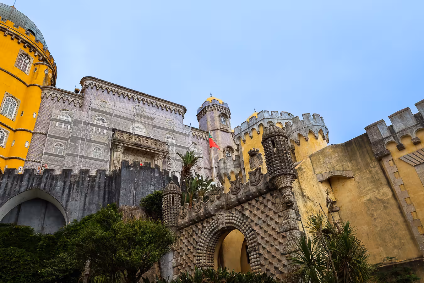 Colorful facade of Pena Palace in Sintra, showcasing vibrant architecture on a clear day, perfect for a small group tour.