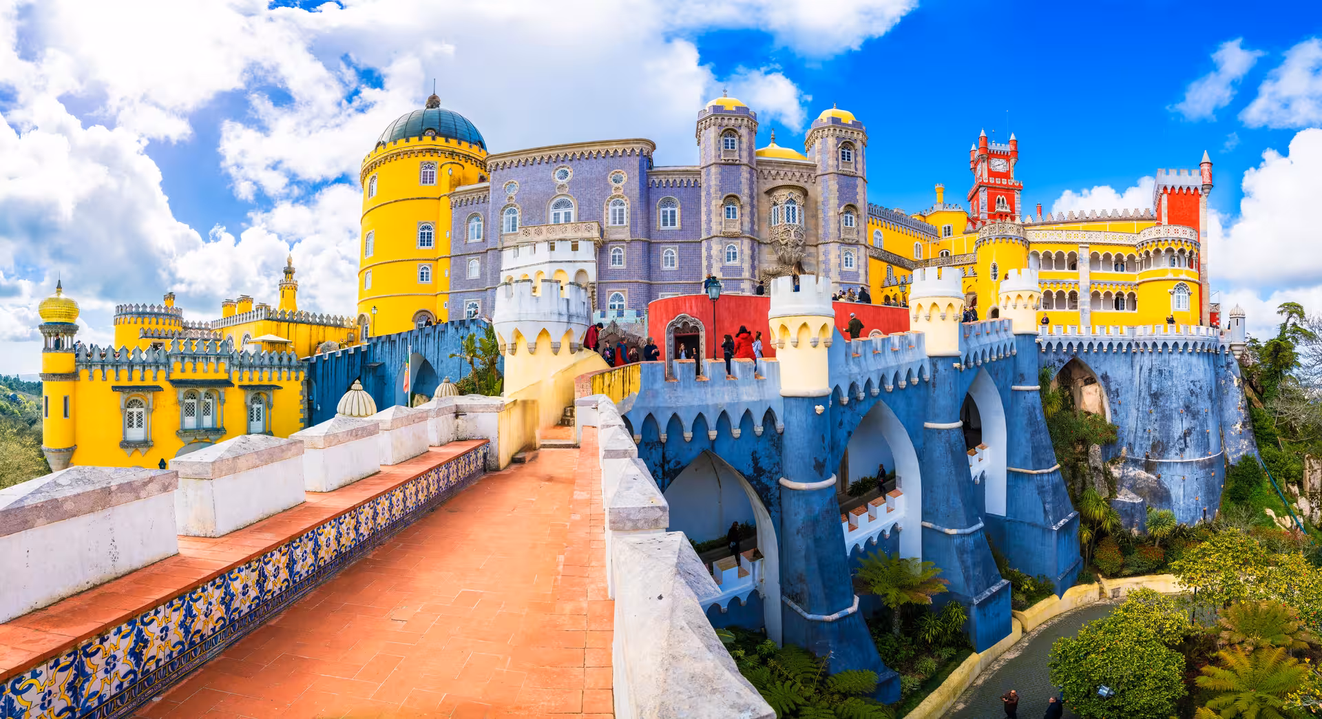 Vibrant view of Pena Palace's colorful architecture in Sintra, a highlight of the Lisbon small-group tour.
