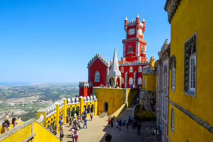 Vibrant Pena Palace in Sintra, Portugal, with colorful architecture and scenic views, featured in a private guided tour experience.
