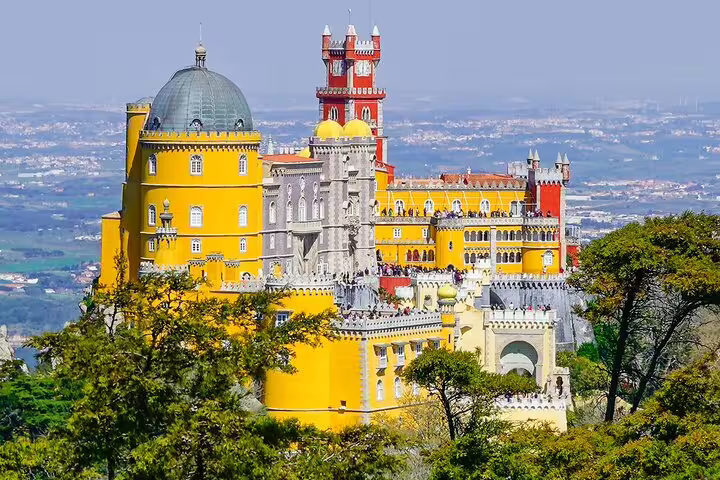 Vibrant view of Pena Palace in Sintra, Portugal, included in private tour with monument tickets from Lisbon.