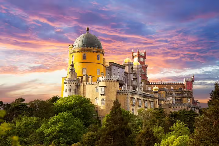Majestic Pena Palace in Sintra at sunset, showcasing vibrant architecture for a customizable full-day tour with private driver.