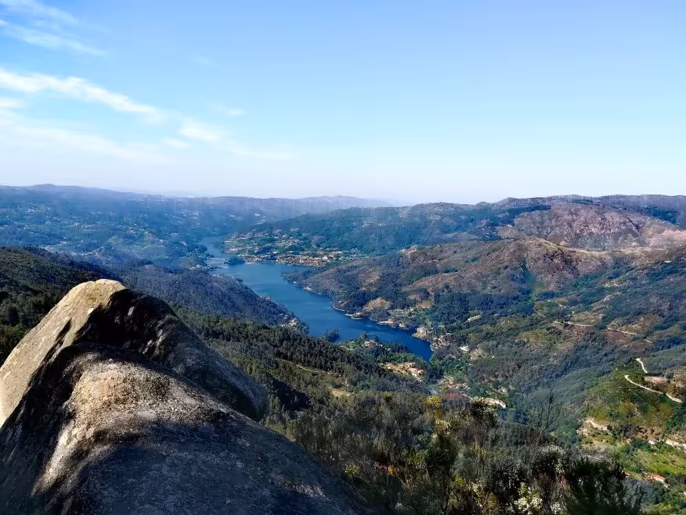 Breathtaking view of river and rolling hills from a high vantage point in Peneda Geres National Park tour.