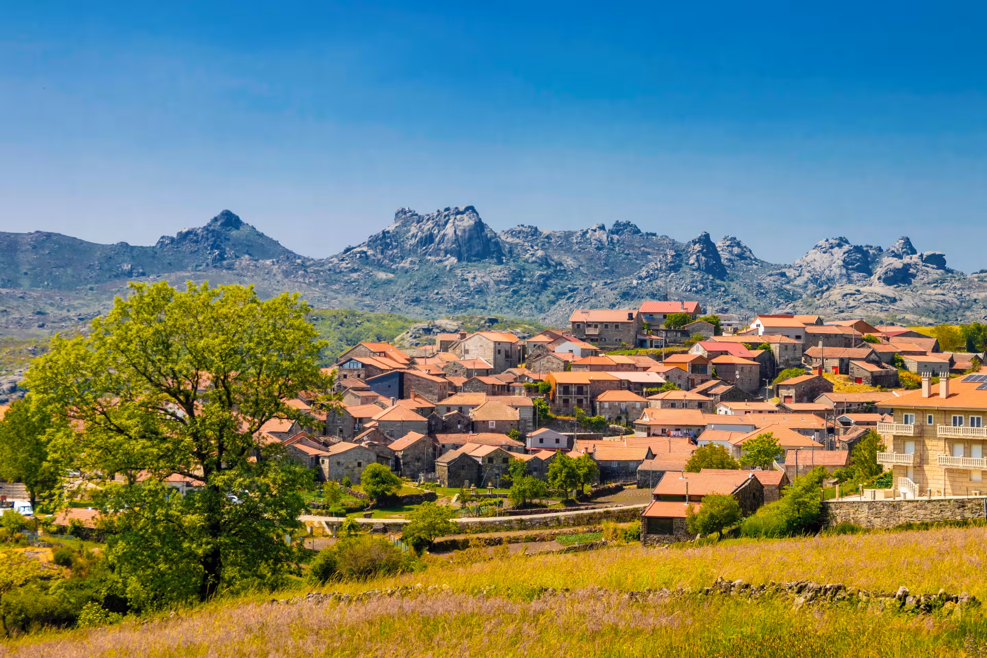 Charming village with terracotta roofs set against rugged mountains in Peneda Geres National Park for 3-day tour.