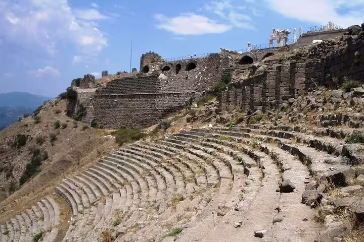 Stone amphitheater ruins at Pergamon with scenic views on Spectacular Pergamon & Asceplion Tour from Kusadasi.