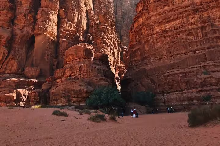 Towering red sandstone canyon in Petra, Jordan, visited on Petra day trip from Taba by ferry boat