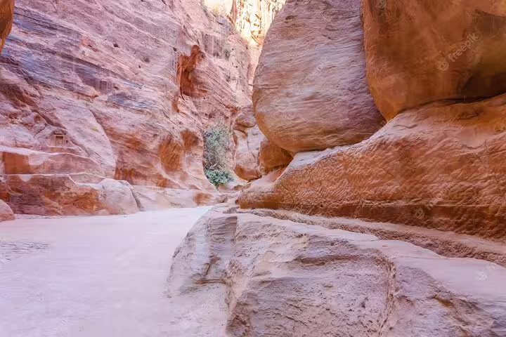 Narrow sandstone passage in Petra, Jordan, on full day tour from Sharm El Sheikh to the ancient city