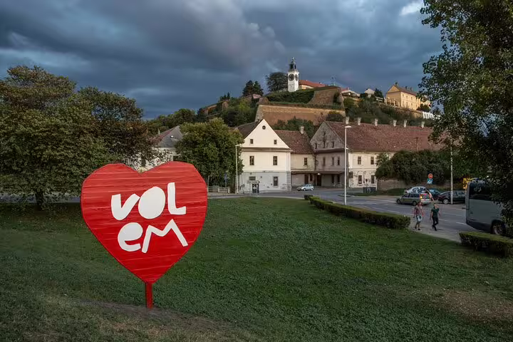 Red heart “Volim” sign with Petrovaradin Fortress above, Novi Sad private half-day Serbia tour stop