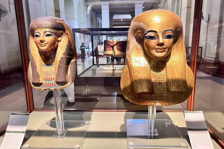 Golden pharaoh funerary masks in Cairo museum, included in Pyramids of Giza and Cairo day tour by plane from Sharm