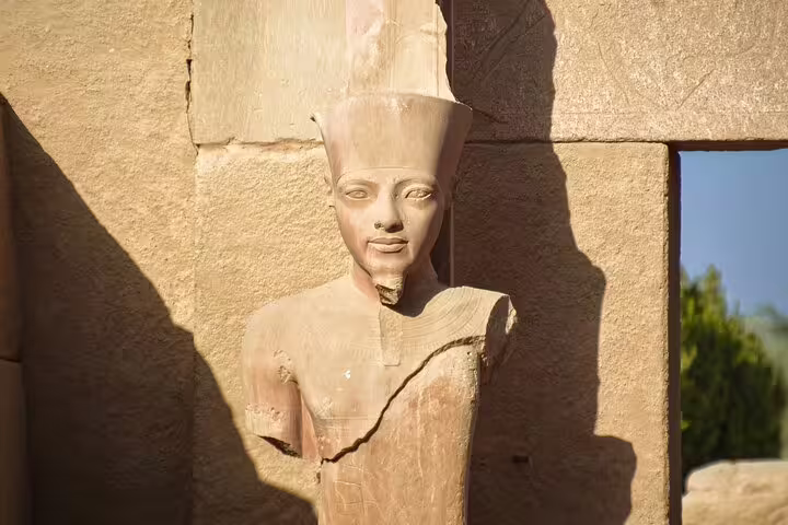 Ancient pharaoh statue at Dendera Temple in Egypt, iconic stop on a day tour to Dendera and Abydos Temples