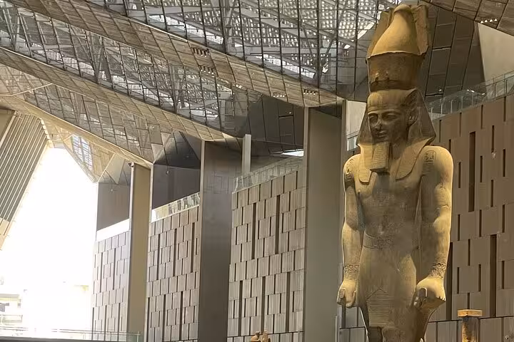 Colossal pharaoh statue inside the Grand Egyptian Museum in Cairo, featured on a private Giza Pyramids day tour