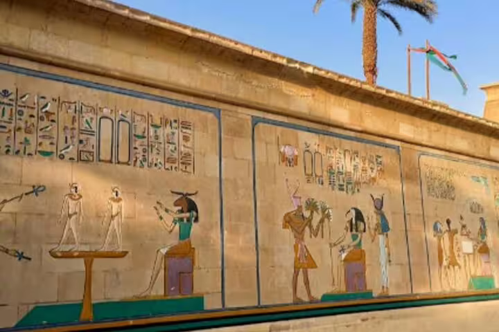 Colorful ancient Egyptian mural at Pharaonic Village Cairo, featured on a private guided tour experience