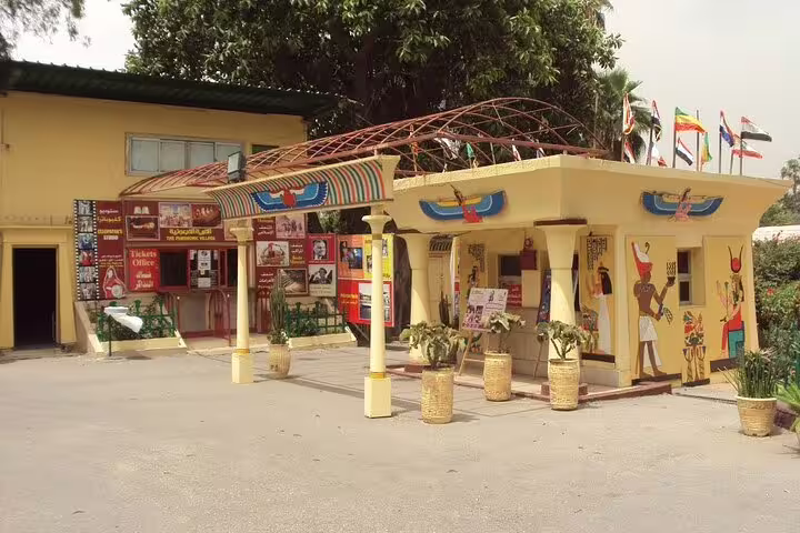 Pharaonic Village Cairo entrance and ticket office with ancient Egyptian murals on a private tour