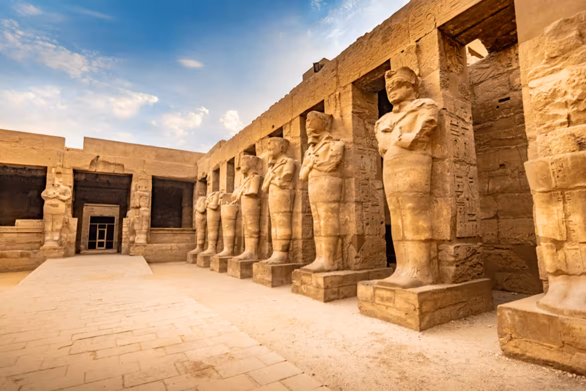 Philae Temple courtyard with carved guardian statues in Aswan, historic stop on Egypt Golden Triangle 11-day tour