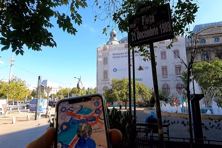 Self-guided walking tour app at Piata 21 Decembrie 1989 square in Bucharest Revolution historic site