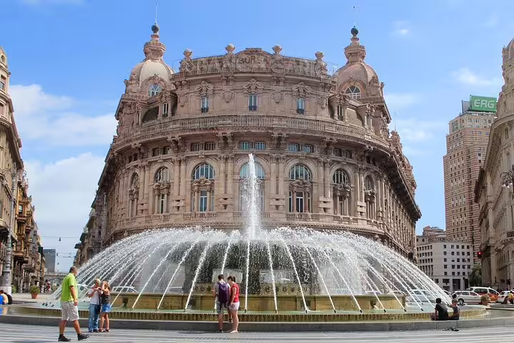 Ornate Palazzo della Borsa building with large fountain in Piazza De Ferrari, Genoa, Italy