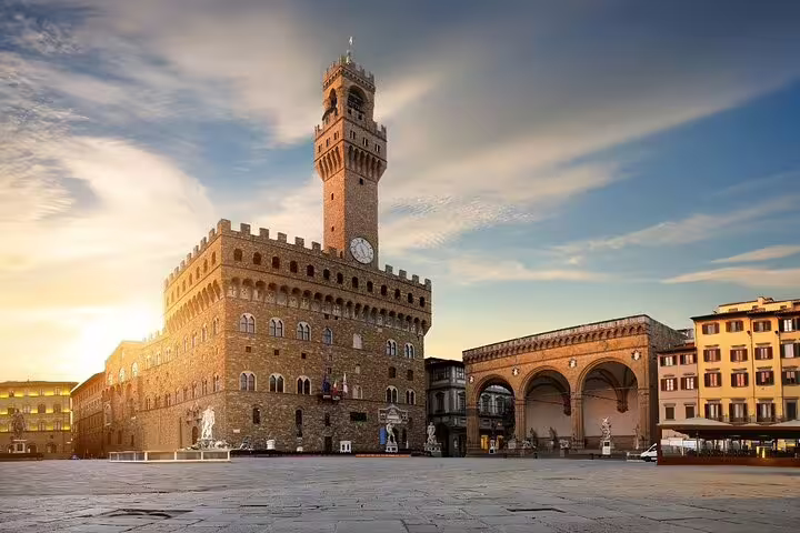 Piazza della Signoria and Palazzo Vecchio at sunrise on a Florence day trip from Rome with guided sightseeing