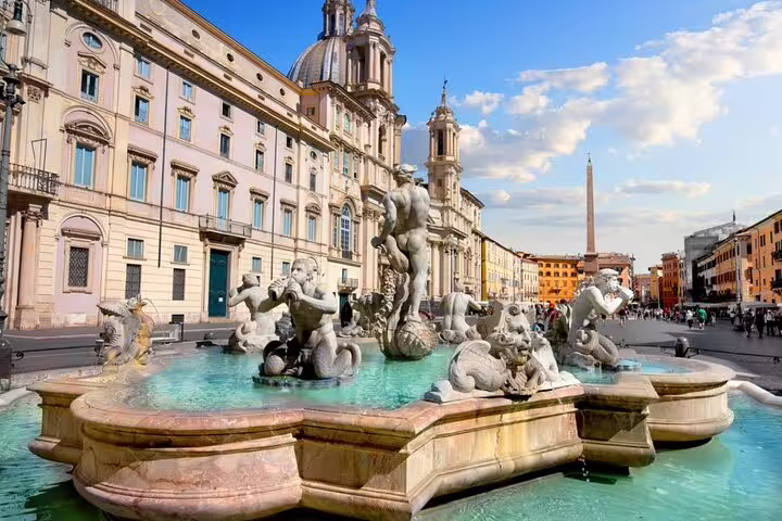 Fontana del Moro and obelisk at Piazza Navona, Rome, with Baroque church and marble sculptures