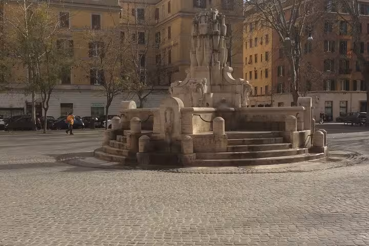 Historic fountain in Piazza Testaccio, Rome, showcasing ancient Roman architecture on a private food tour route.