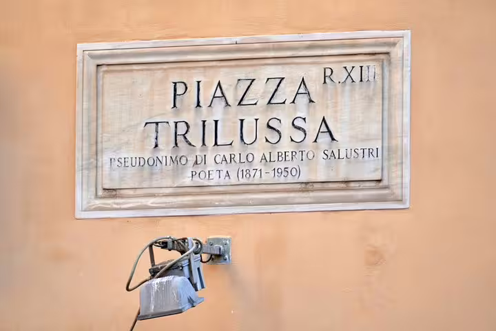 Marble street sign for Piazza Trilussa in Trastevere Rome, honoring poet Carlo Alberto Salustri 1871-1950