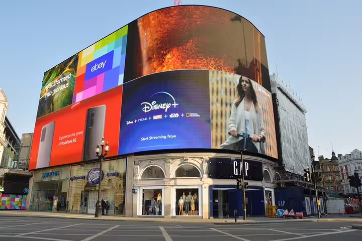 Piccadilly Circus LED billboards and shops in central London, featured stop on a full-day London sightseeing tour