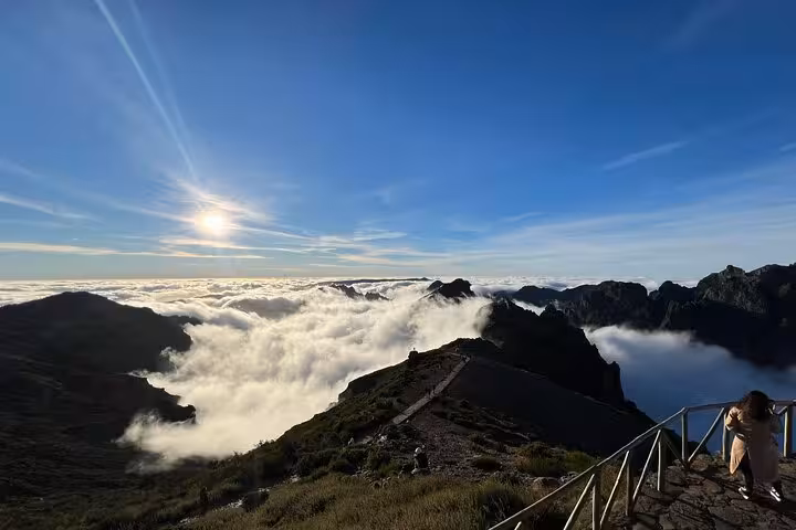 Sunrise above clouds at Pico do Areeiro viewpoint on Madeira East 4x4 expedition toward Ponta São Lourenço