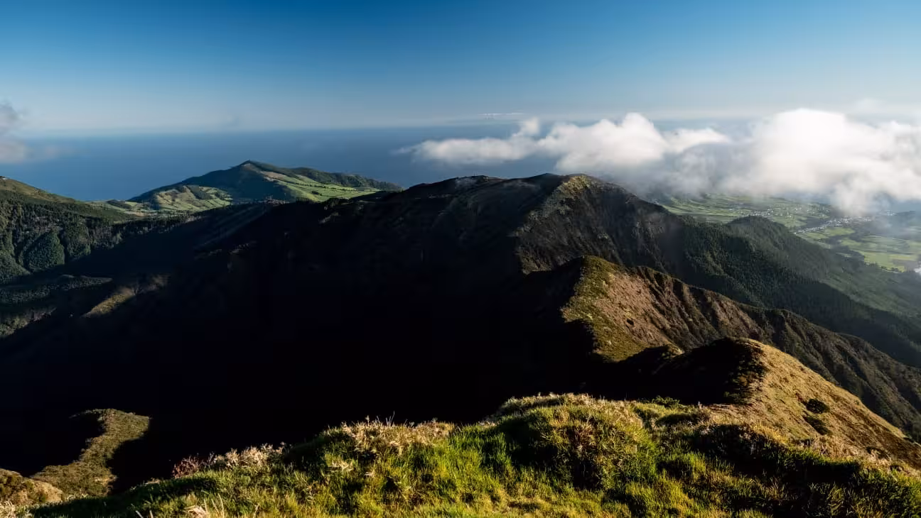 Panoramic ridge view on Pico da Vara hiking trail, São Miguel Azores, with clouds and Atlantic ocean