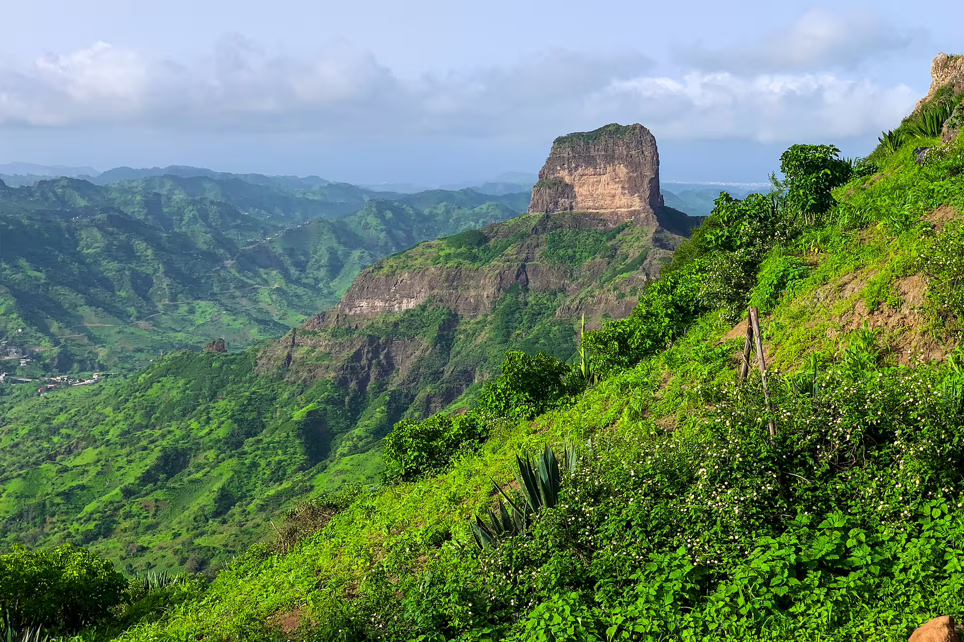 Verdant hills and the distinctive rock formations of Pico D'Antónia in Santiago's Monte Tchota Natural Park.