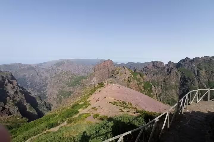Majestic mountain peaks and lush trails of Pico Ruivo, offering a stunning hiking experience with panoramic views.