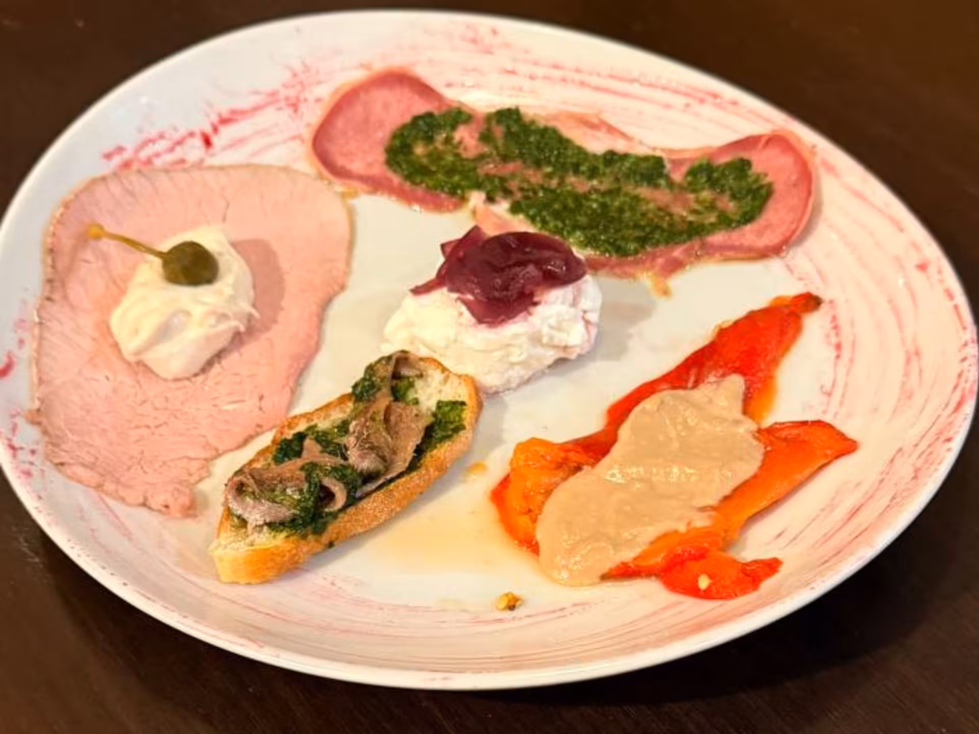 Colorful Piedmontese tapas plated with diverse toppings, highlighting authentic Turin culinary experiences.