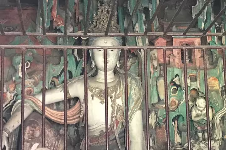 Intricate stone sculpture within a Pingyao temple, part of the Beijing to Xian private tour by bullet train.