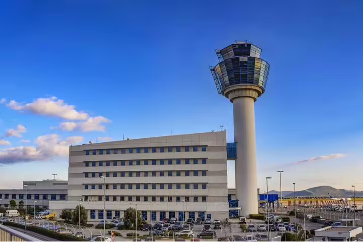 Athens International Airport control tower, destination for private departure transfer from Piraeus cruise port