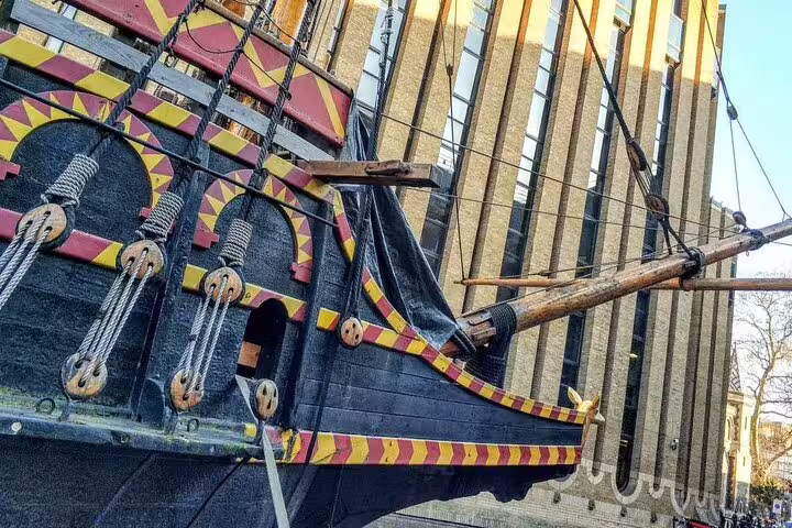 Black and red decorated tall ship bow with rigging and pulleys, Southwark London