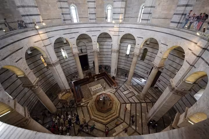 Discover the intricate interior of Pisa's Baptistery on an exclusive shore excursion from Livorno port.