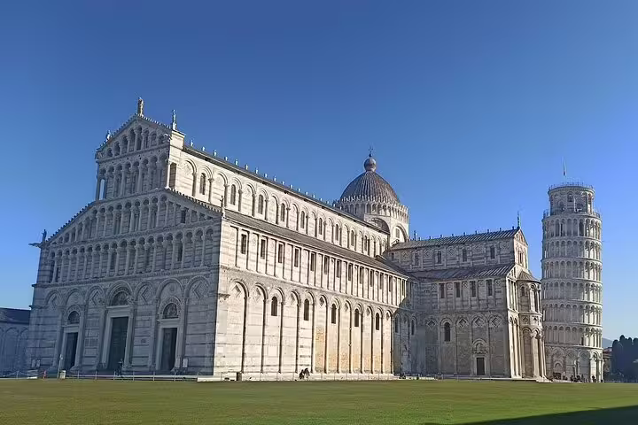 Pisa Cathedral and Leaning Tower under clear blue skies, visited on a private Pisa and Chianti day tour from Tuscany