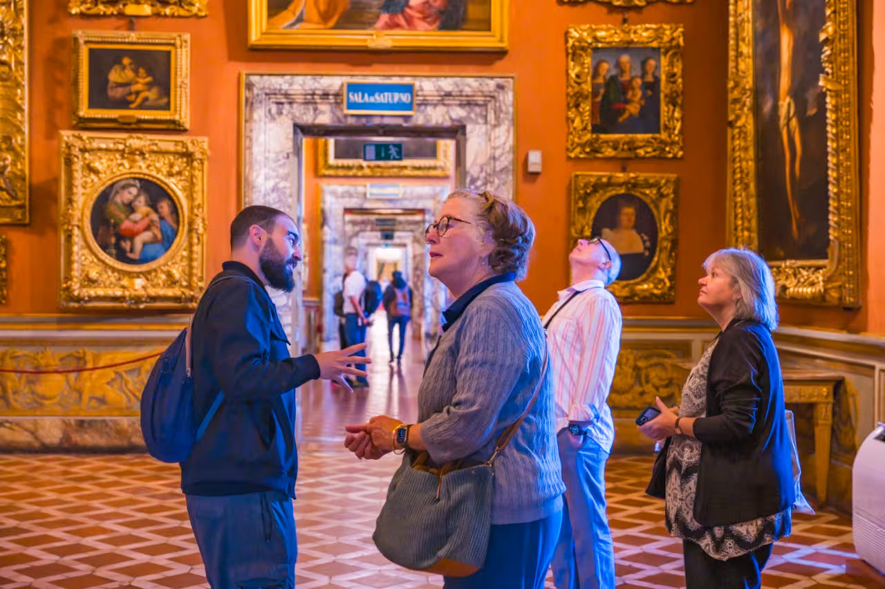 Group exploring the art-filled galleries of Pitti Palace during a small group tour.