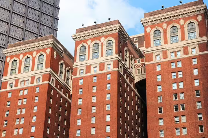 Historic red brick buildings with ornate arched windows in downtown Pittsburgh