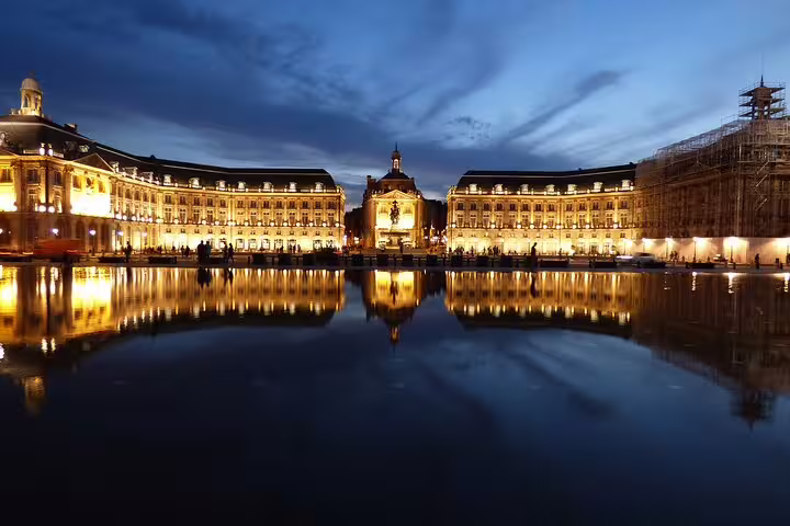 Place de la Bourse Bordeaux at dusk reflecting on the Water Mirror, highlight of private walking tour