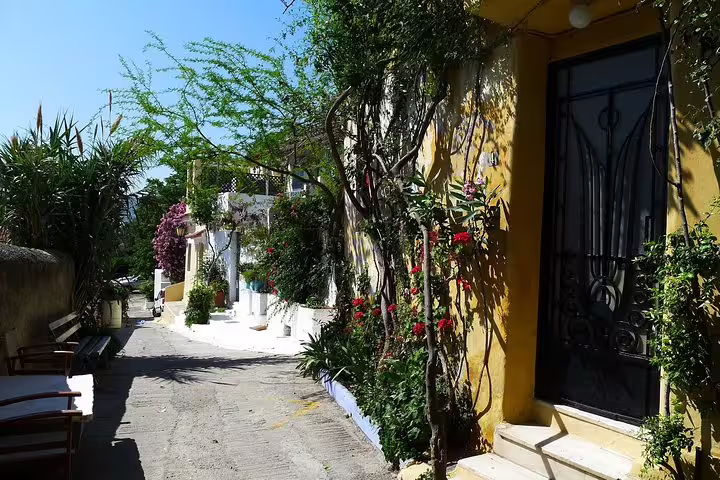 Charming Plaka alley in Athens with flowers and traditional houses, seen on a guided walking tour to the Acropolis