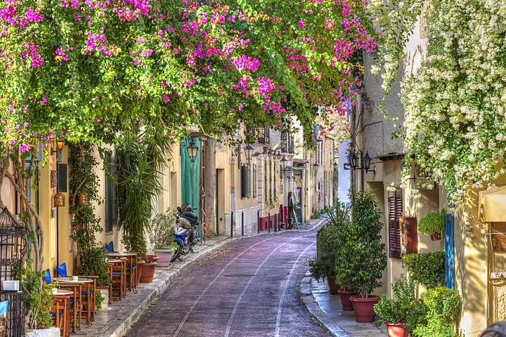 Charming Plaka street in Athens with bougainvillea, a highlight stop on a Best of Athens half day private tour