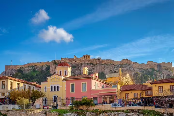 Plaka neighborhood colorful houses with Acropolis hill backdrop on a private half-day Athens city tour, skip the line