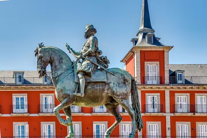 Plaza Mayor Madrid statue on a self-guided e-scavenger hunt tour, exploring landmarks at your own pace