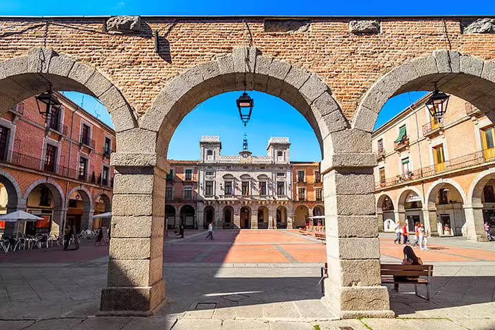 Plaza del Mercado Chico arcades in Ávila, scenic stop on private minivan tour from Madrid to Ávila and Segovia