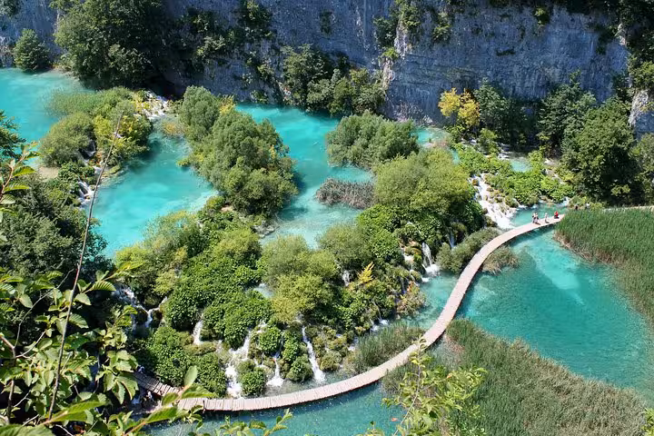 Plitvice Lakes National Park boardwalk over turquoise waterfalls, highlight of 11-day private Croatia tour
